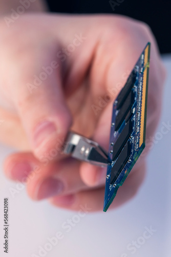 Technician fixing computer. Repair and upgrade concept of laptop. Workshop background