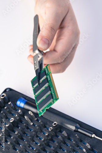 Technician fixing computer. Repair and upgrade concept of laptop. Workshop background