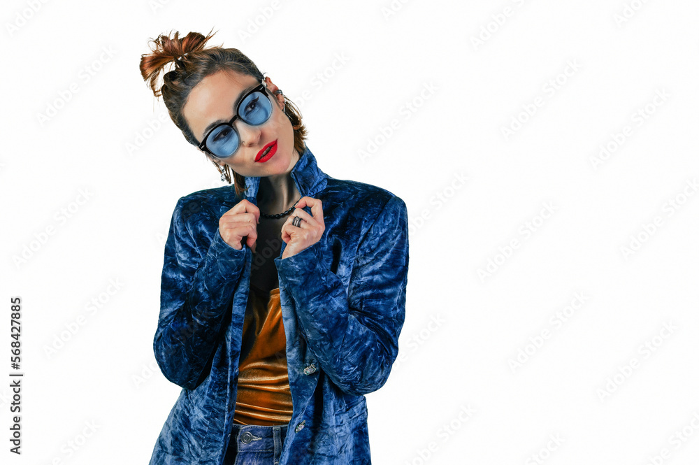 Young woman with glasses on a white background.Charming smiling woman poses against white studio wall. Young woman with glasses on a white background.Charming smiling woman poses against white studio wall.