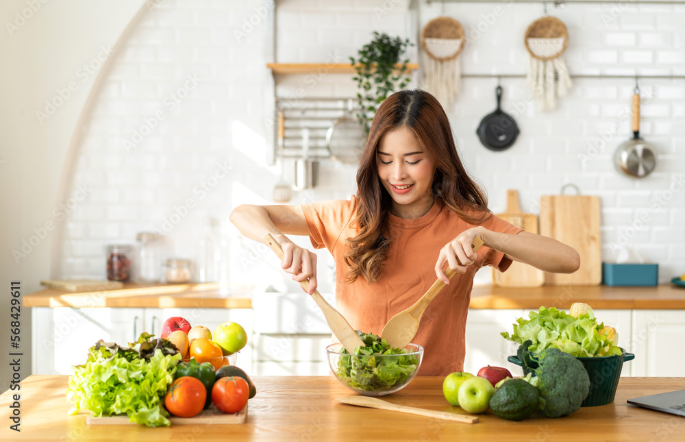 Portrait of beauty body slim healthy asian woman having fun cooking and preparing cooking vegan food healthy eat with fresh vegetable salad in kitchen at home.Diet concept.Fitness and healthy food Portrait of beauty body slim healthy asian woman having fun cooking and preparing cooking vegan food healthy eat with fresh vegetable salad in kitchen at home.Diet concept.Fitness and healthy food