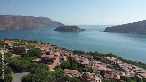 View of the island of Spinalonga with calm sea. Gulf of Elounda, Crete, Greece.