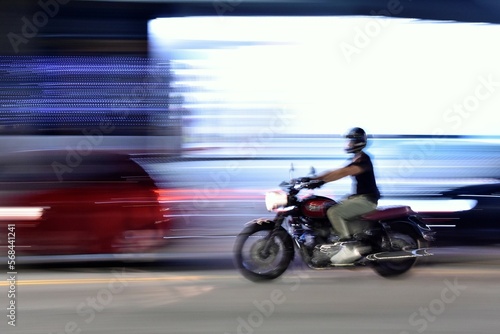 person riding a motorcycle, panning © Erika