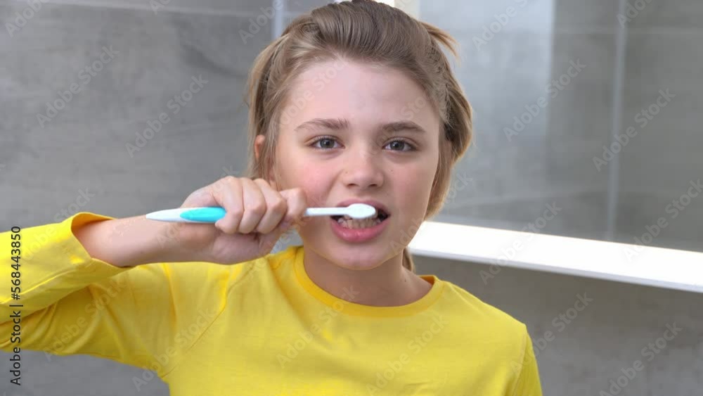 Teenager Boy Brush Teeth Child In Bathroom Looking At Camera, Dentistry, Stomatology, Dental Care And Hygiene With Toothbrushes, Morning Evening Routine, Lifestyle, Health Care. Teenager Boy Brush Teeth Child In Bathroom Looking At Camera, Dentistry, Stomatology, Dental Care And Hygiene With Toothbrushes, Morning Evening Routine, Lifestyle, Health Care.