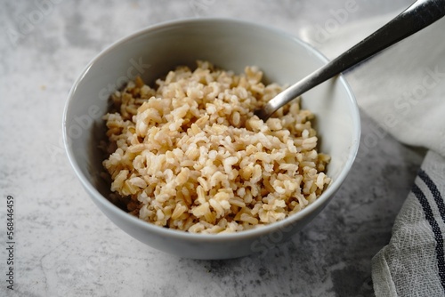 Cooked brown rice served in a bowl, selective focus