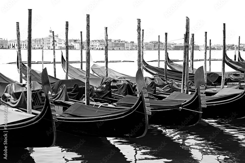 gondolas typical boat of Venice in Italy moored with black and white effect