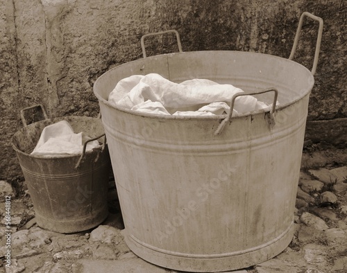 bucket and tub for doing the laundry with sepia effect from the 1920s
