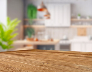 Wood table top on blurred kitchen background.