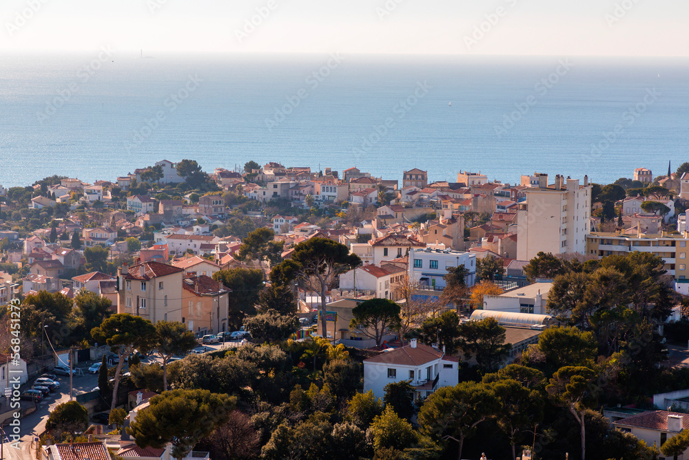 Marseille, France - FEB 28, 2022: Beautiful horizon view with golden sunlight from the coast of Marseille