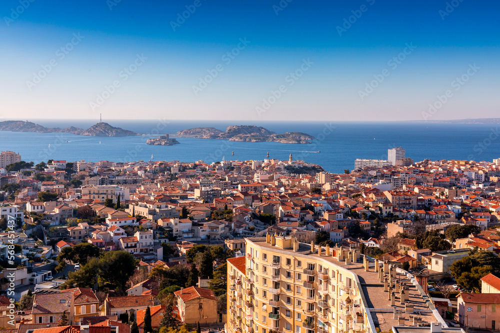 Marseille, France - FEB 28, 2022: Beautiful horizon view with golden sunlight from the coast of Marseille