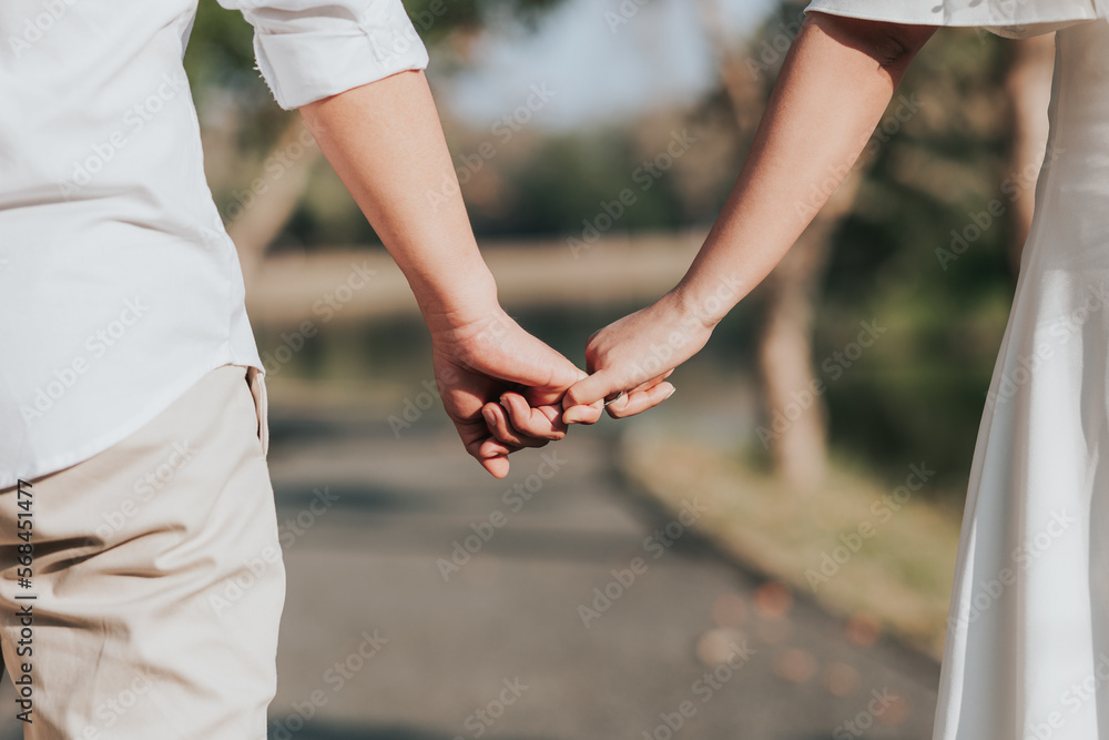 Couple holding hands at sunset. Couple holding hands at sunset.