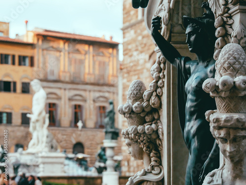Close-up of the pedestal statue of Perseus and the Medusa and Fountain of Neptune in Florence, Italy, situated on the Piazza della Signoria  photo