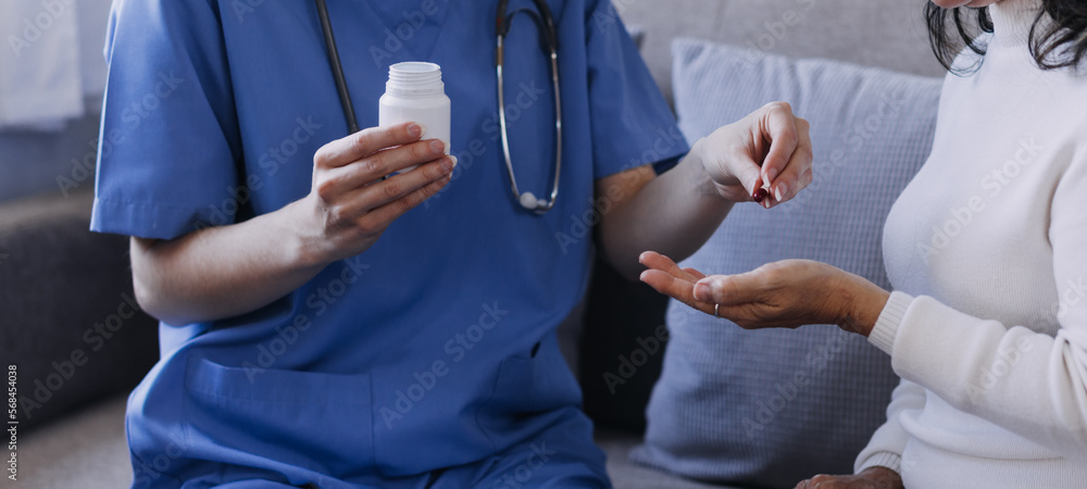 Homecare nursing service and elderly people cardiology healthcare. Close up of young hispanic female doctor nurse check mature caucasian man patient heartbeat using stethoscope during visit Homecare nursing service and elderly people cardiology healthcare. Close up of young hispanic female doctor nurse check mature caucasian man patient heartbeat using stethoscope during visit
