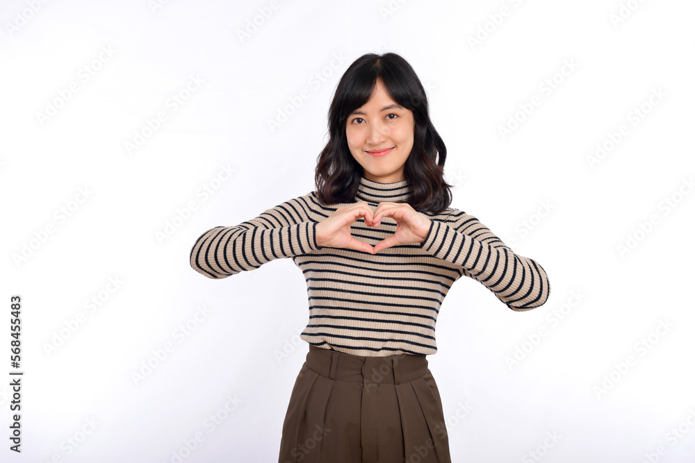 Young asian woman hands making a heart shape on a white isolated background Young asian woman hands making a heart shape on a white isolated background