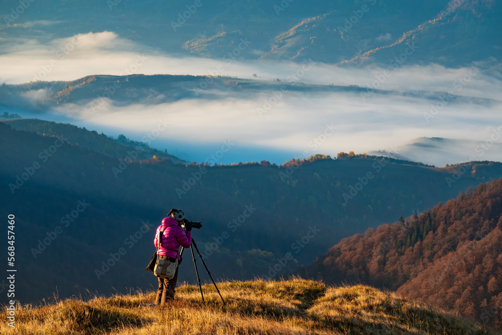 Professional photographer with tripod Professional photographer with tripod