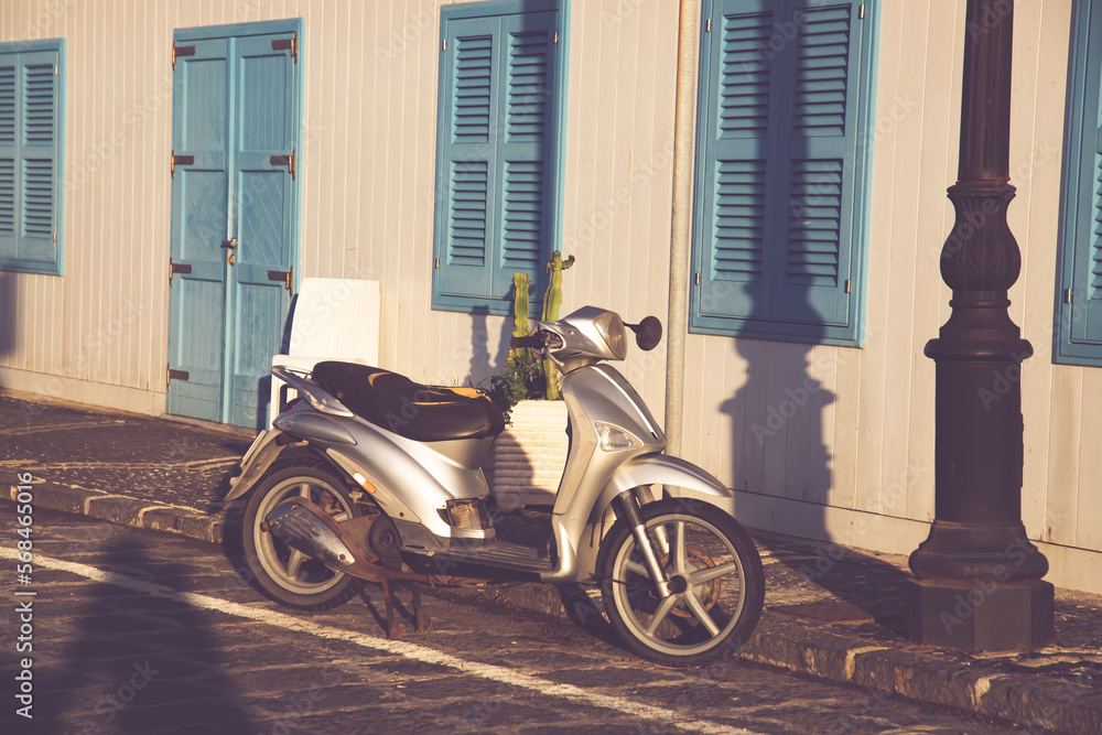 Old fashioned motorbike on a street of Procida Island, Italy