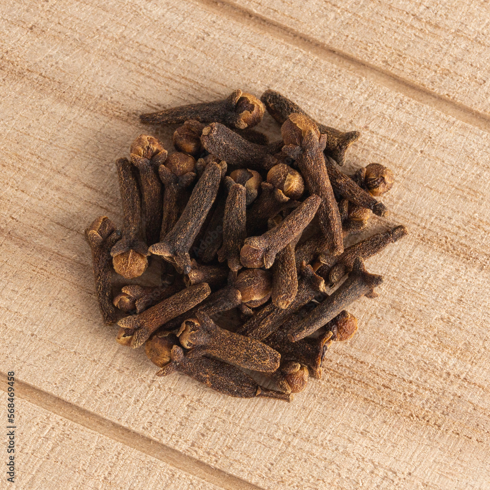 Fototapeta premium Cloves on the wooden background