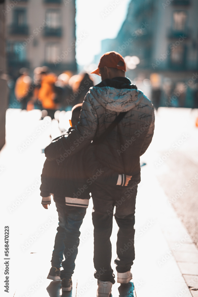 two people walking in the city