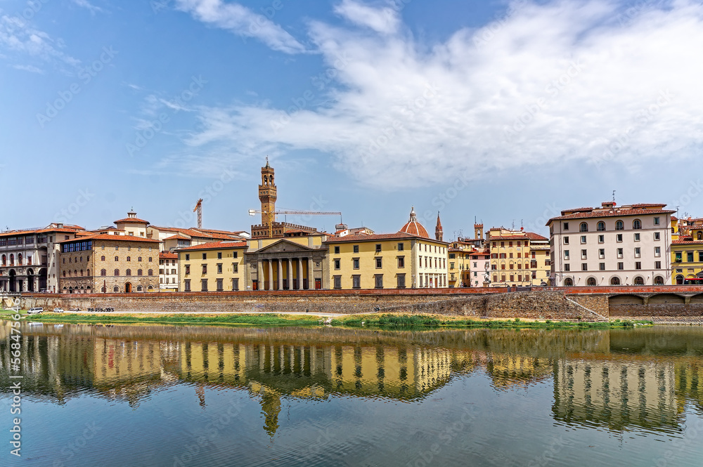Sunny view over the River Arno in Florence in Tuscany Italy with its most famous medieval building the Palazzo Vecchio or the town hall and Santa Maria del Fiore or Il Duomo