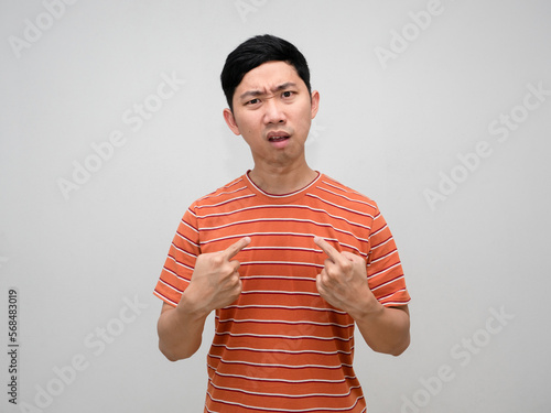 Man orange striped shirt feels confused point finger at himself isolated