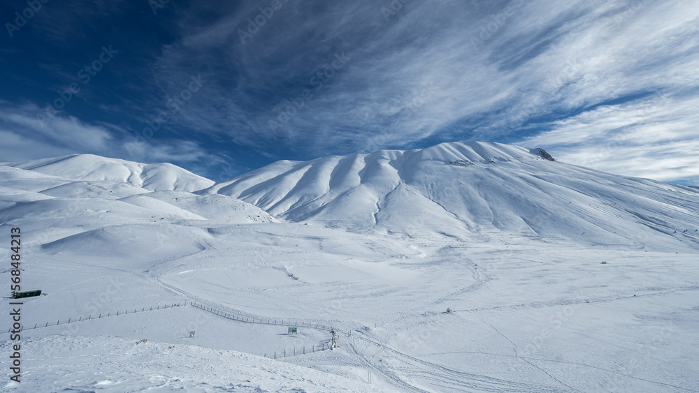 Monte Vettore and Piana di Castelluccio covered with fresh snow. The concept of strong powerful nature is expressed with a sense of freedom and silence
