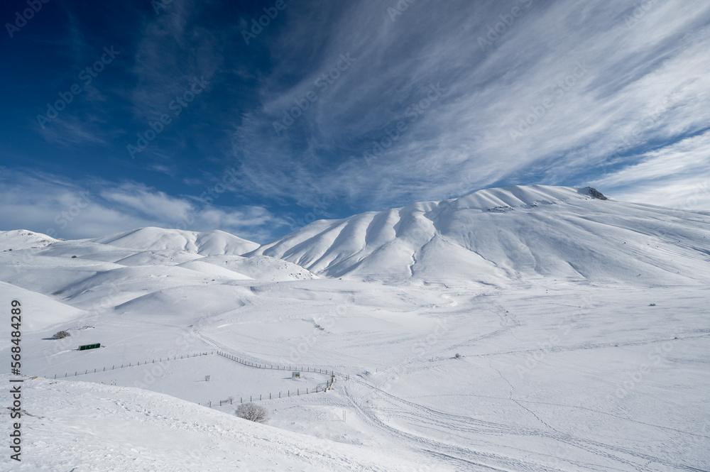 Monte Vettore and Piana di Castelluccio covered with fresh snow. The concept of strong powerful nature is expressed with a sense of freedom and silence
