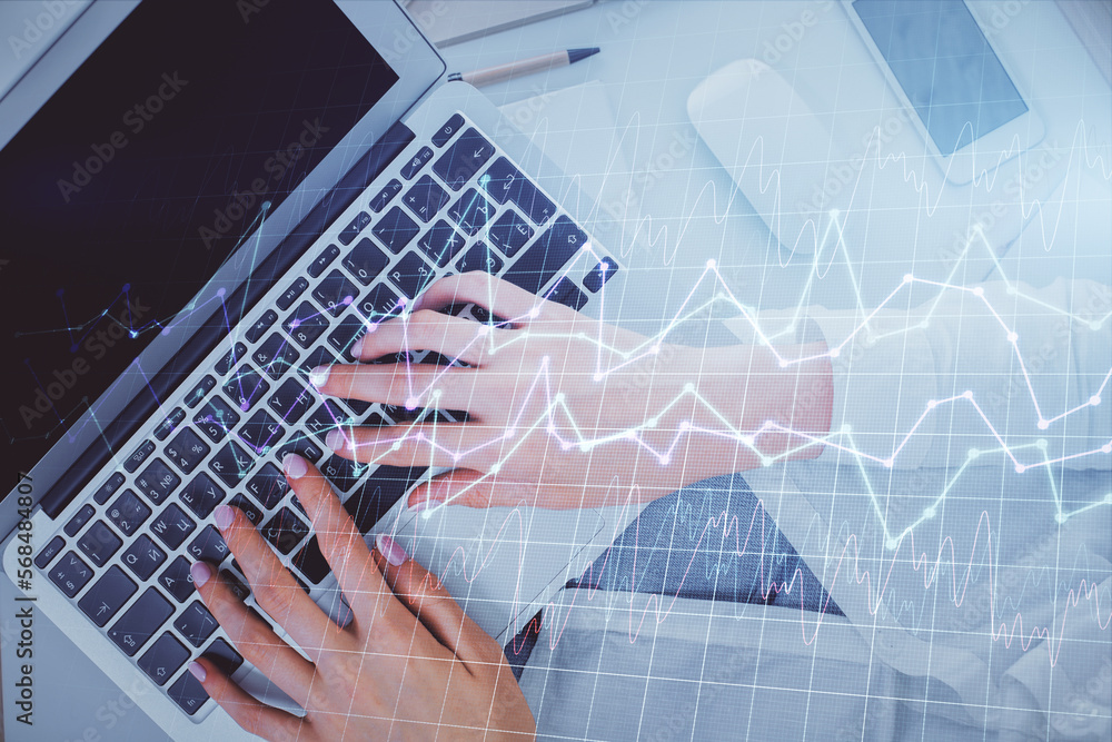 Double exposure of woman hands working on computer and forex chart hologram drawing. Top View. Financial analysis concept. Double exposure of woman hands working on computer and forex chart hologram drawing. Top View. Financial analysis concept.