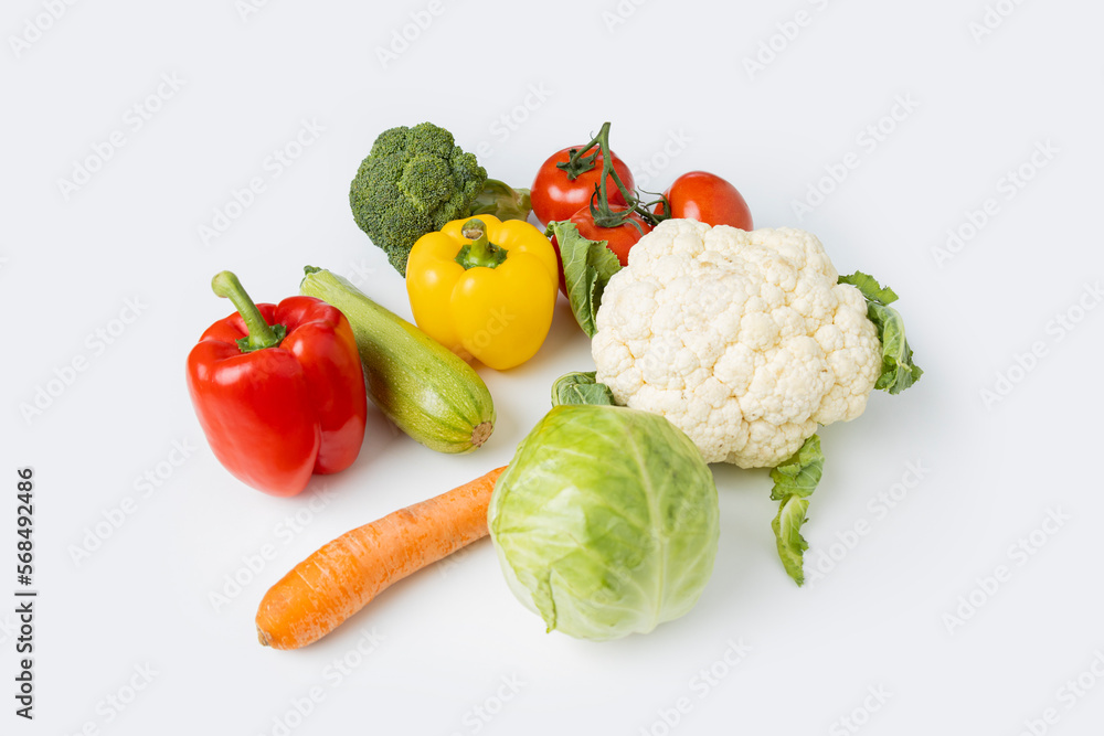 Fresh whole vegetables on a white table. Cooking, diet Fresh whole vegetables on a white table. Cooking, diet