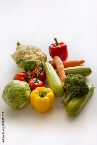 Fresh whole vegetables on a white table. Cooking  diet