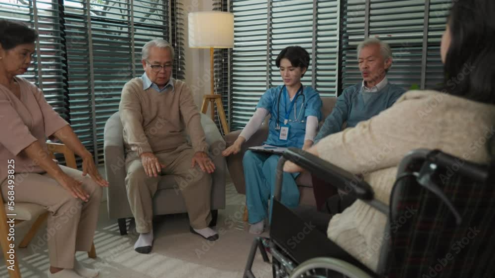 Senior, nurse sit in circle raise to meditate in nursing home Senior, nurse sit in circle raise to meditate in nursing home