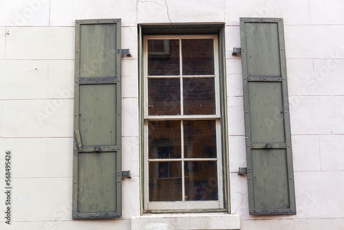 Window with iron shutters in historic California building