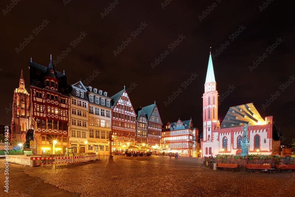 Night scenery of Romerberg ( Roman Mountain ) Square, a famous tourists destination in the old town of Frankfurt City, Germany, with beautiful medieval buildings and spires illuminated at nighttime