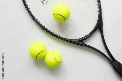Big tennis sports equipment, racket and balls, layout on a white background. Still life Sports. © vladdeep