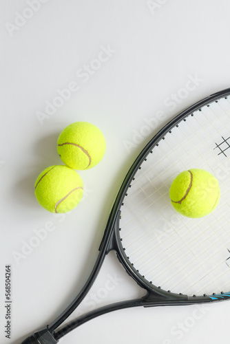 Big tennis sports equipment, racket and balls, layout on a white background. Still life Sports.