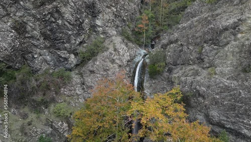 Incredible view of the Millomeris Waterfall among the fascinating forest. The view from the drone. Amazing view in Cyprus.