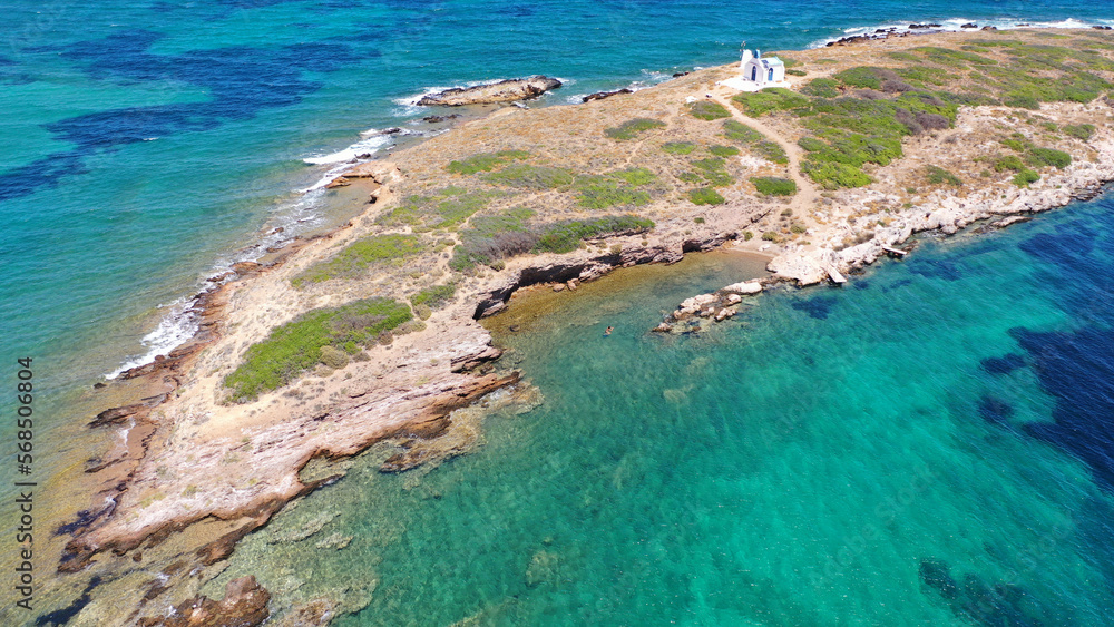Aerial photo of picturesque small chapel of Saint Alexandros in small islet of Vravrona surounded by turquoise clear waters, Attica, Greece