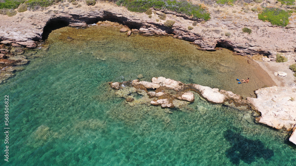 Aerial drone photo of tropical exotic paradise bay with deep turquoise sea forming a blue lagoon