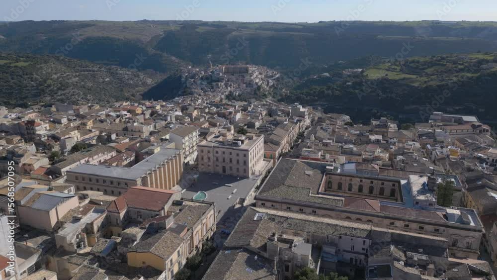 view of Ragusa Ibla flying backward over San Giovanni cathedral in upper Ragusa view of Ragusa Ibla flying backward over San Giovanni cathedral in upper Ragusa