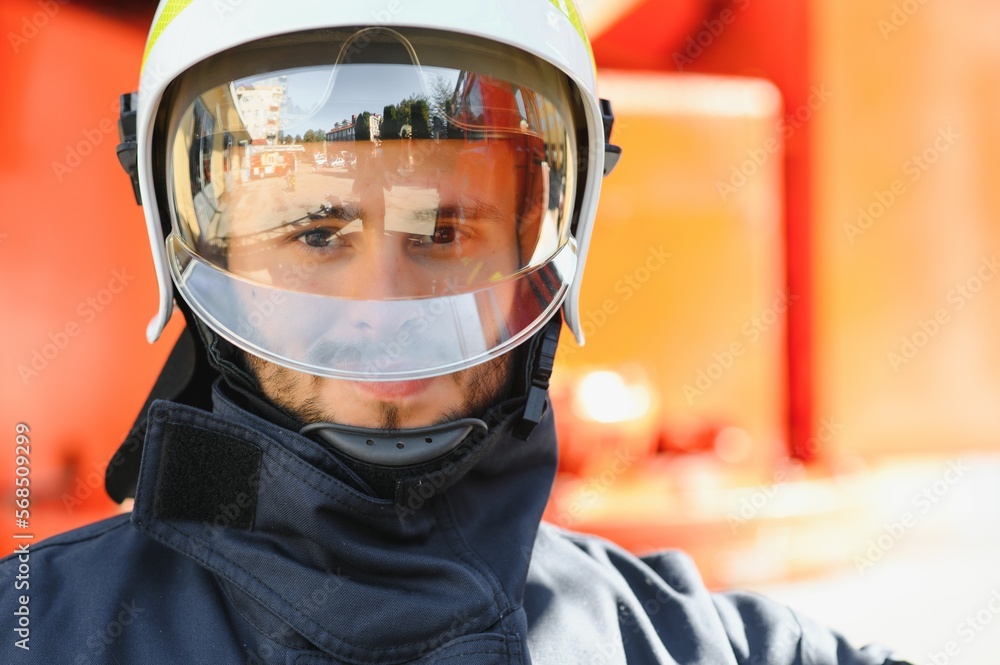 Firefighter portrait on duty. Photo fireman with gas mask and helmet near fire engine. Firefighter portrait on duty. Photo fireman with gas mask and helmet near fire engine.