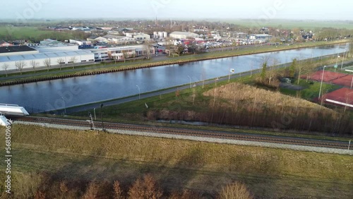 perpendicular span near white bridge over water in countryside