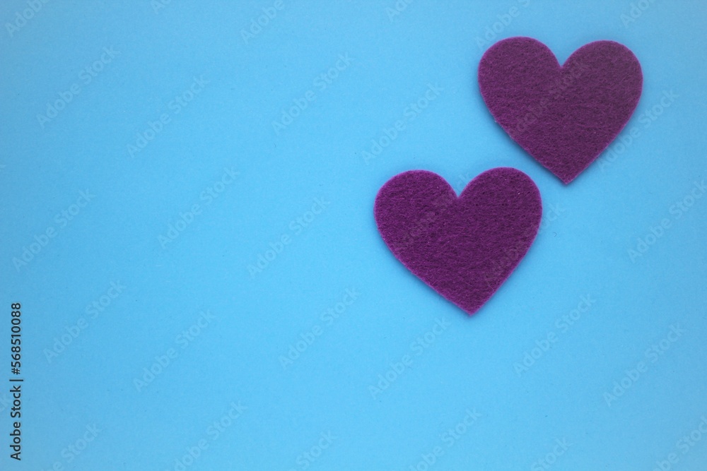 Valentine's day background. Valentine's day concept. Symbol of St. Valentine's Day. Purple seeds on a blue background. Background, postcard. Space for writing
