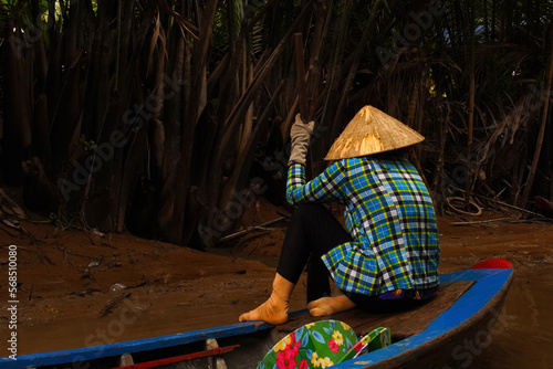 Woman on the mekong river in a boat