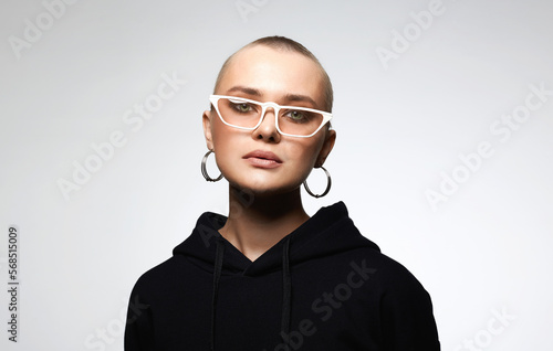 beautiful young woman wearing Hoodie and glasses
