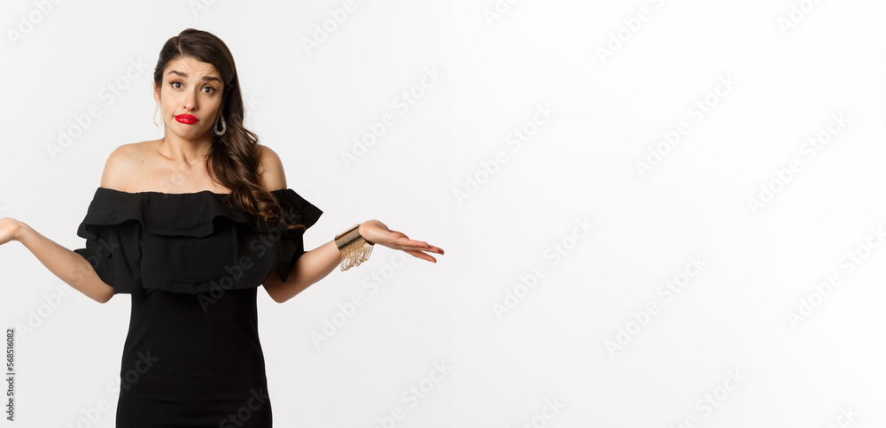 Fashion and beauty. Clueless attractive woman in black dress dont