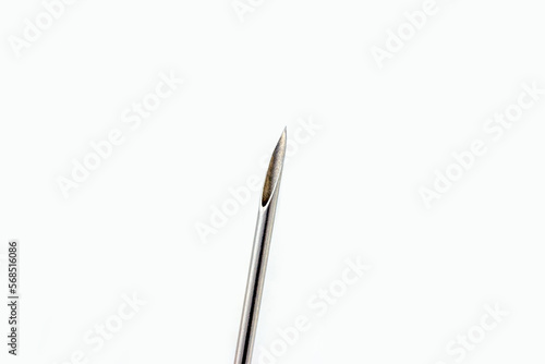 Tableau sur toile Steel medical cannula needle for injections on white background with copy space close up