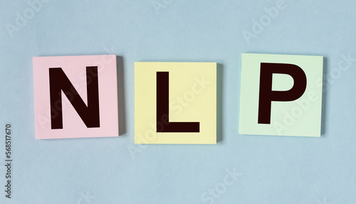 Neurolinguistic programming, NLP acronym on papers photo