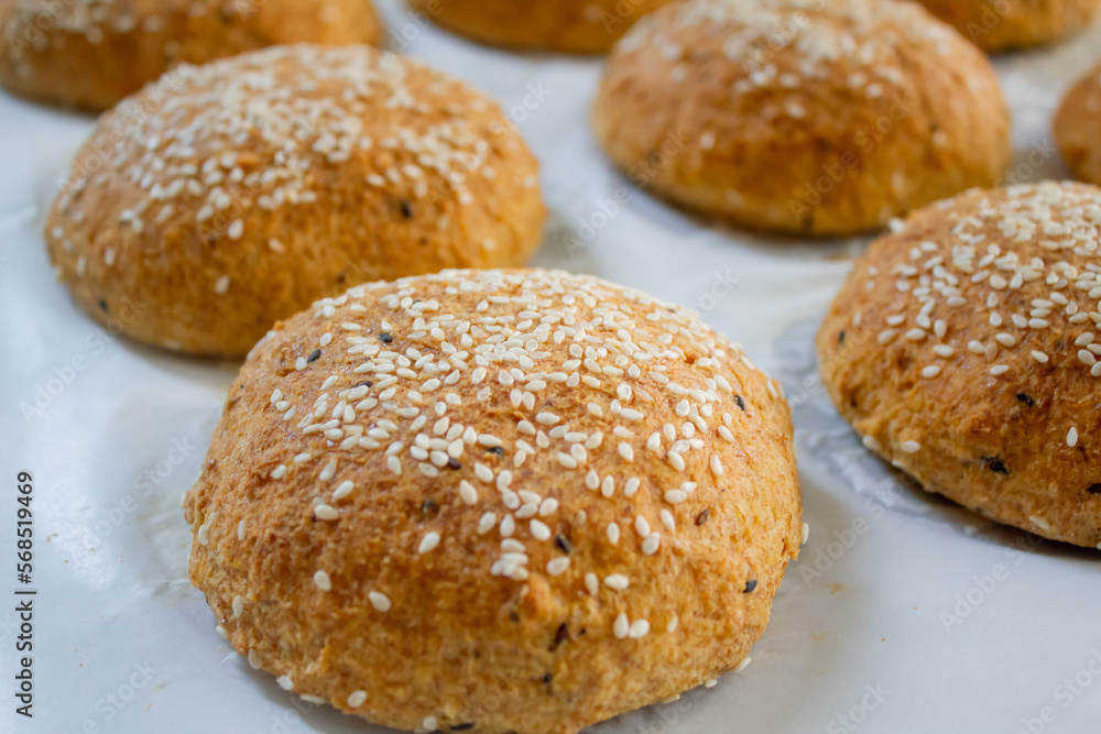 Fresh baked keto buns, Low carb buns baked with psyllium husk and flax seeds. Ketogenic diet and healthy eating concept, selective focus.
