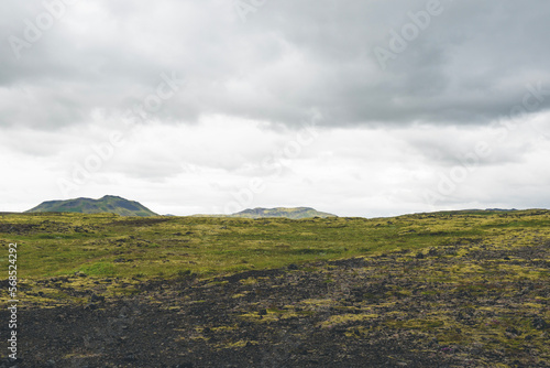 Vast land covered with gravel and moss in Iceland on cloudy day