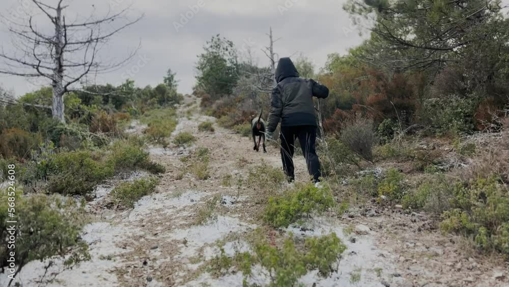 Young Boy Wearing Hood, Climbing Hiking Hill With His Dog Young Boy Wearing Hood, Climbing Hiking Hill With His Dog