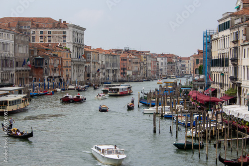Venetian canals with countless boats and gondolas. 