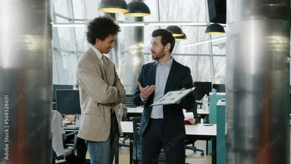 Close-up view of bearded, caucasian businessman presenting new statistics. Portrait of positive and smiling businessmen in formal suits having a discussion and brainstorm. High quality 4k footage Close-up view of bearded, caucasian businessman presenting new statistics. Portrait of positive and smiling businessmen in formal suits having a discussion and brainstorm. High quality 4k footage